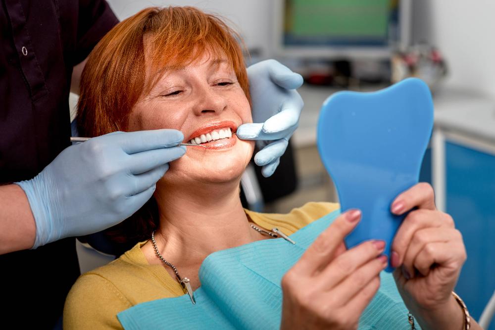 local cosmetic dentist | woman at dentist