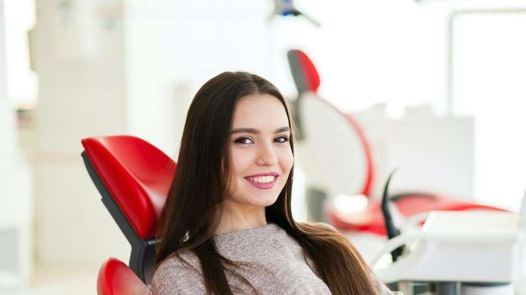 woman getting a new dental crown in Brentwood tn