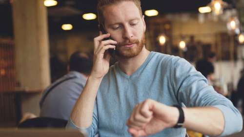 man checking his watch before his dentist visit in brentwood tn