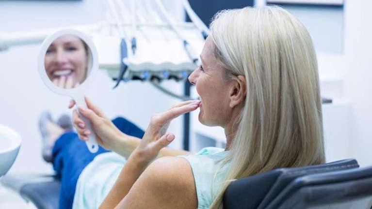 woman after teeth whitening in brentwood tn