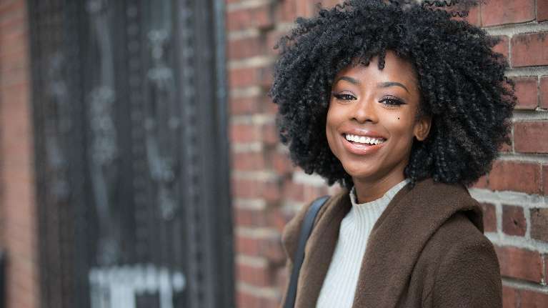 Confident woman showing bright smile after cosmetic dentistry in Brentwood TN