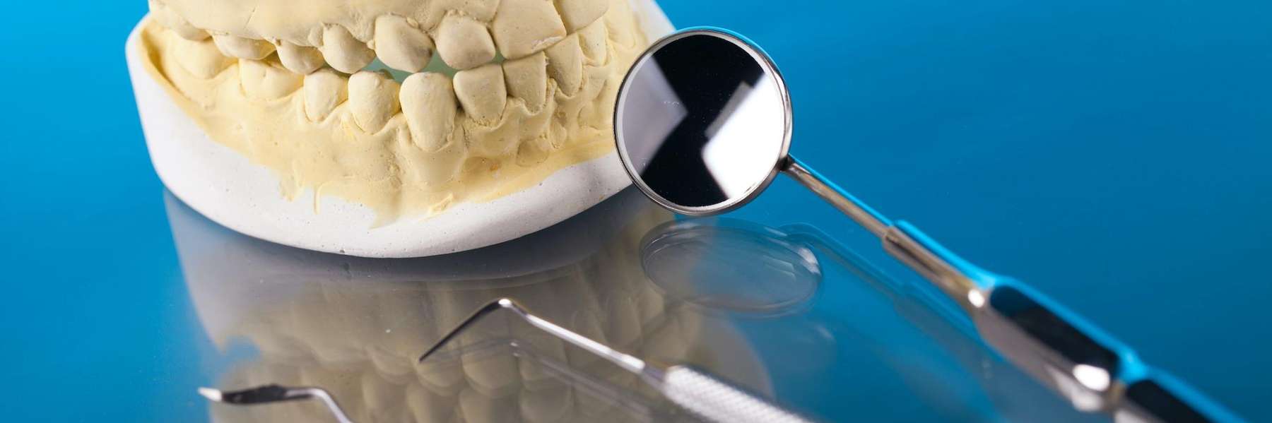 image of teeth and dental tools